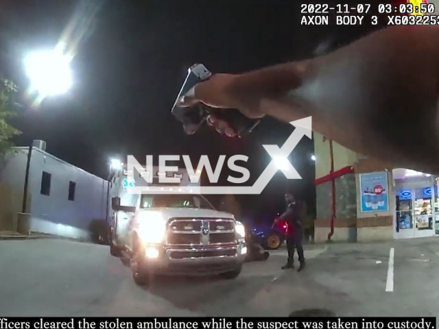 Police officer pointing the gun at a thieving suspect who attempted to flee with a stolen ambulance before they arrest him in Atlanta, USA on Monday, November 7, 2022. Williams was charged with Theft by Taking, Traffic Light Violation, and Driving in Proper Lane. Note: The picture is a screenshot from a video (@Atlanta_Police/Newsflash).