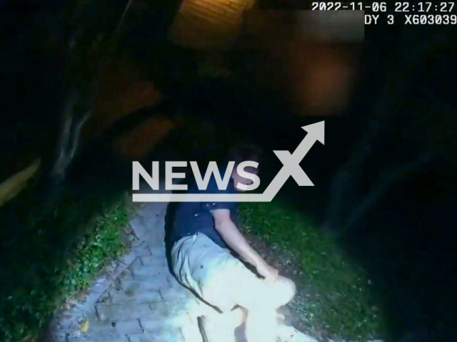 City Councilman  Clayton Perry laying injured on the ground in his yard with his car still running at his residence in the city of San Antonio, in the US state of Texas.  Councilman  Clayton Perry was allegedly involved in a crash that occurred half a mile from the place he was found. Note: Picture is screenshot from a video(San Antonio Police Department/Newsflash).