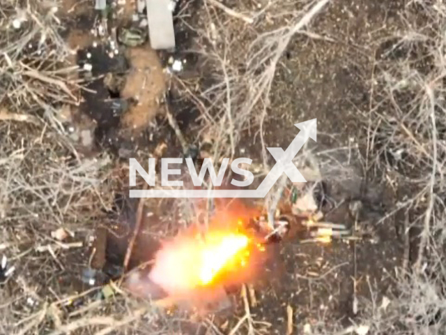 Picture shows an explosion in foxhole in a field area of Bakhmut, Donetsk region, Ukraine in undated photo. Fighters of 30th Prince Konstanty Ostrogski Mechanized Brigade detected Russian soldiers in foxholes and dropped bombs on them. Note: Picture is a screenshot from a video (@30brigade/Newsflash)