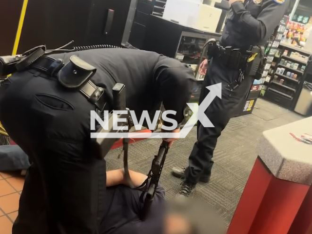 Phoenix Police arrests a shooter in a convenience store in Phoenix, Arizona, USA on Thursday, Oct. 27, 2022. An employee filmed the violent arrest, which captured the use of physical force by officers. Note: Picture is a screenshot from a video(PhoenixPolice/Newsflash).