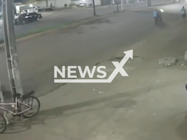 A man runnig from two men on a motorcycle shooting at him in Palmas, Brazil, Wednesday, Nov. 16, 2022. Marcus Elson  was then run over by a car during his escape.  Note: Picture is a screenshot from a video (Newsflash)