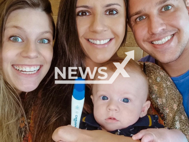 Carol Rizola, (left) Douglas Queiroz (right) and Kah Marques, (middle) and their child Henrique pose in a photo released on social media with the announcement of a second pregnancy, undated. The three people are in a relationship together and are having their second child, in Londrina, Brazil.
Note: Private photo.  (@meutrisal/Newsflash)