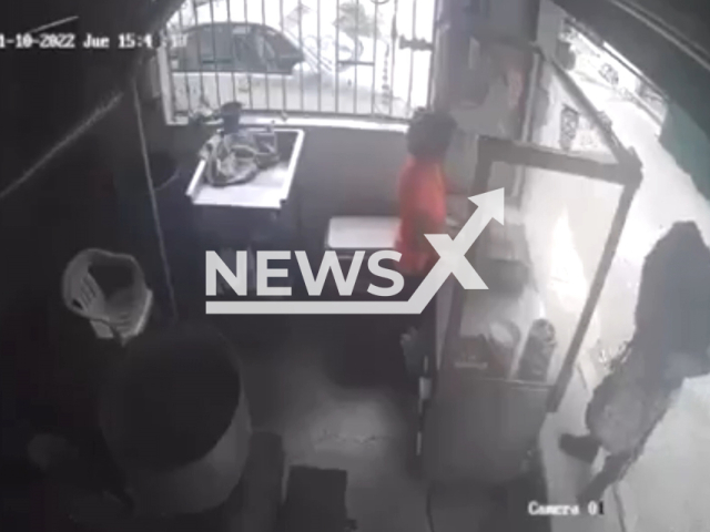 A man   threatens the worker of a tortilla shop, in Zihuatanejo, Mexico, on Thursday, Nov, 10, 2022.  The owners of the tortilla shop had complained on different occasions to the authorities that they are being extorted, and  in  June, 2022 several merchants closed their businesses for three days to put pressure on the authorities to fix the issue.   Note: Picture is a screenshot from a video (Newsflash)