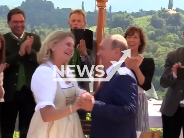 Russian President Vladimir Putin dancing with the Ex-Foreign Minister Karin Kneissl at her wedding in Austria in August 2018. Note: Photo is a screenshot from a video(Newsflash).