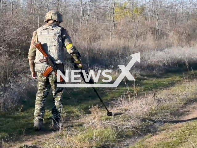 Ukrainian sapper of the engineering and sapper unit of the separate airmobile brigade of Ukrainian Airborne Assault Troops searches for Russian anti-tank and anti-personnel mines in the Kherson region, Ukraine. The footage was obtained from the Command of the Airborne Assault Troops of the Armed Forces of Ukraine on Wednesday, Nov. 23, 2022. Note: Picture is a screenshot from a video (@ua_dshv/Newsflash)