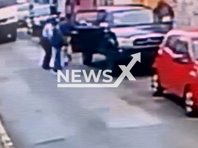 A handcuffed man runs away from three police officers arresting him, in Orizaba, Mexico, undated. The police officers who made the arrest were taken into custody, and an investigation will be carried out. Note: Picture is a screenshot from a video (Newsflash)