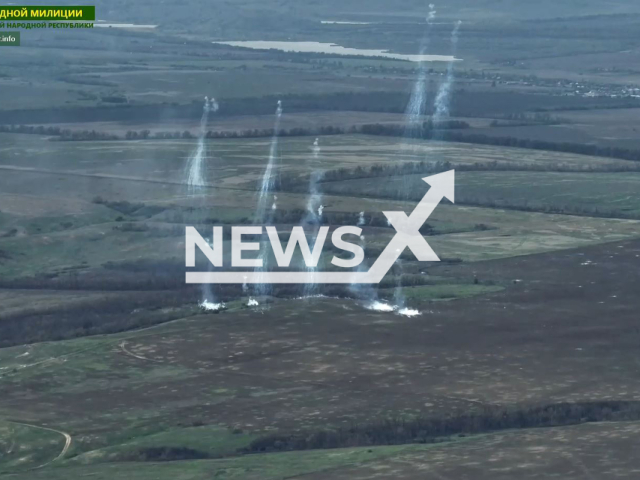 Bombs fall in the forest belt near Berestove, Donetsk region, Ukraine in undated photo. Servicemen of the 4th brigade of the 2nd army corps of the People's Militia of the LPR with fire support by artillery and mortar crews attacked Ukrainian army. Note: Picture is screenshot from a video (@millnr/Newsflash)