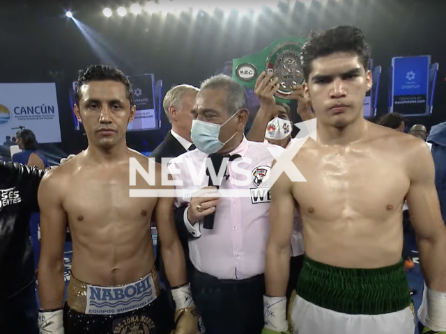 Moises Fuentes (left) poses with David Cuellar (right) before he was defeated to him in October 2021. Fuentes, a Mexican professional boxer, passed away on Thursday, Nov. 24, 2022, after suffering from a  brain clot in his defeat to David Cuellar. Note: Picture is a screenshot from a video (Newsflash)