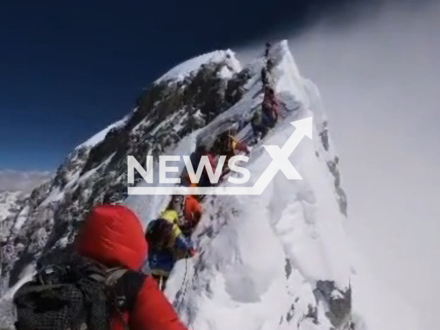 Mountaineers ascend the Southeast Ridge to the South Summit in the death zone, on top of Mt. Everest, on May 23, 2019. Many deaths in high-altitude mountaineering have been caused by the effects of the death zone. Note: Picture is a screenshot from a video (@climbtocurediabetes/Newsflash)