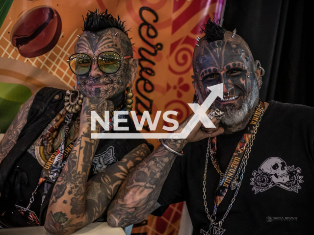 Víctor Hugo Peralta, 52, poses with his wife, Gabriela Rios, 51, at the Urcunina tattoo festival in Pasto, Colombia, in October 2022. According to Victor, between the two of them, they have already exceeded a hundred modifications. Note: We obtained permission for this photo. (Carmen Sofia Bravo/Newsflash)