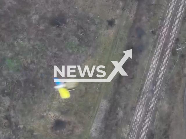 Bombs with colors of Ukrainian flag falls on Russian soldiers in Bakhmut, Donetsk region, Ukraine. The footage was obtained from the 30th separate mechanized brigade of the Ukrainian Ground Forces on Sunday, Nov. 27, 2022. Note: Picture is a screenshot from a video (@30brigade/Newsflash)