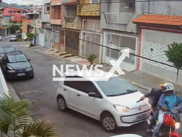 A driver runs over armed thieves on motorcycle  during robbery on Saturday, Nov. 26, in Sao Bernardo do Campo, Brazil. The robbers managed to escape without being identified, the motorcycle license plate fell,  and the motorcycle was  seized by the police, nothing was stolen. Note: Picture is a screenshot from a video (Newsflash)