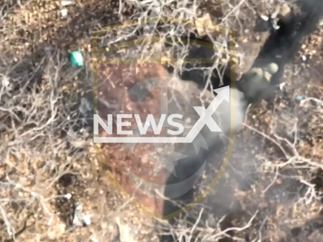 Bomb explodes near Russian soldiers hiding in trenches in Bakhmut, Donetsk region, Ukraine. The footage was obtained from the 30th separate mechanized brigade of the Ukrainian Ground Forces on Monday, Nov. 28, 2022. Note: Picture is a screenshot from a video (@30brigade/Newsflash)