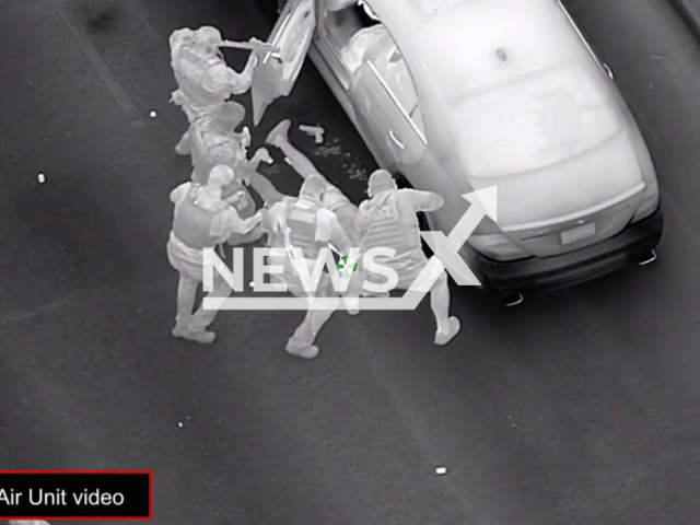 Police officers arrest the suspect Victor Pacheco, 43 after they shot him in Mesa, Arizona, USA on Monday, Sept. 19, 2022. Pacheco was treated at a local hospital before being booked into jail. Note: Photo is a screenshot from a video (The Mesa Police Department/Newsflash).