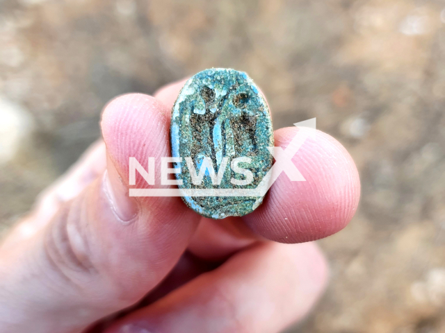 Photo shows the scarab, showing a seated figure on the right and a standing figure with a raised arm on the left, possibly symbolizing the imparting of authority, undated photo. The 3,000-year-old Egyptian scarab seal was found during a middle school field trip in Azor, just outside Tel Aviv, Israel in November 2022. Note: Licensed photo (Gilad Stern, Israel Antiquities Authority/Newsflash)