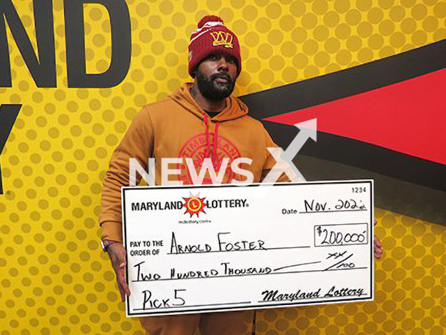 Arnold Foster poses with his USD 200,000 combined prize check, undated.
Playing the same number for years on the Pick 5 tickets he won on Wednesday, Nov. 23, 2022.

Note: Licensed photo.  (Maryland Lottery/Newsflash)