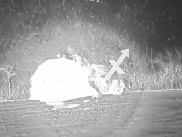 Picture shows an explosion at night in Vodiane, Donetsk region, Ukraine. The footage was obtained from the People's Militia of the DPR on Saturday, Dec. 3, 2022.Note: Picture is screenshot from a video (@nm_dnr/Newsflash).