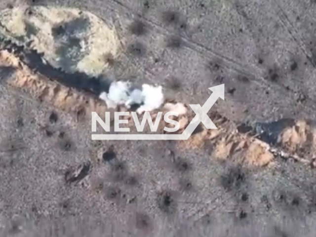 Russian soldiers run through trenches as Ukrainian drones bombard them from the sky in Ukraine in undated footage. The footage was released by the Office of Strategic Communications on Sunday, Dec. 4, 2022. Note: This picture is a screenshot from the video. (@AFUStratCom/Newsflash)