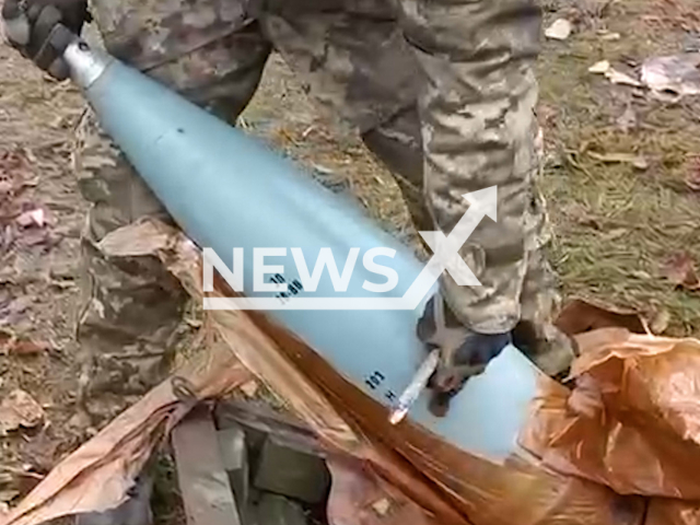 Ukrainian soldier unwraps rocket on the ground in Ukraine. The footage was obtained from the AFU StratCom on Saturday, Dec. 3, 2022. Note: Picture is screenshot from a video (@AFUStratCom/Newsflash).