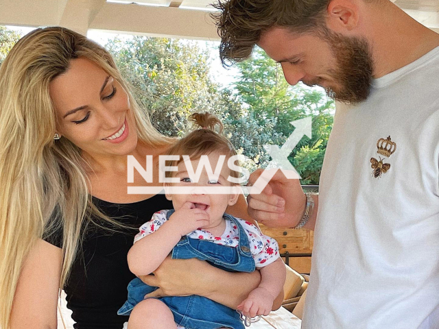 Spanish artist Edurne Garcia (pictured left) who said that she prefers to wait to have more children, her husband David De Gea (right) and their daughter(in the middle).Note: Private photo. (@edurnity/Newsflash)