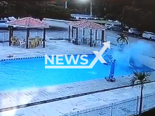 A car drives into pool and almost hits children in Cristino Castro, Brazil, on Saturday, Dec. 3, 2022.  The car was submerged in the water, but the driver got out of the vehicle unharmed, the children swam away. Note: Picture is a screenshot from a video (Newsflash)