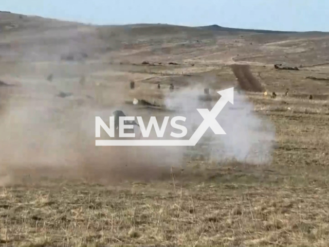 Mobilized soldiers from Russia train to shoot on specially equipped areas near front line in Ukraine. The footage was obtained from the People's Militia of the LPR on Saturday, Dec. 3, 2022. Note: Picture is screenshot from a video (@millnr/Newsflash).