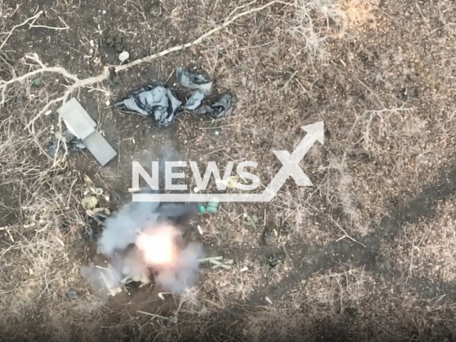 Picture shows an explosion in a foxhole with Russian soldiers in a field area in Ukraine in undated photo. Drone operators of the Ukrainian joint tactical group "Adam" dropped bombs on Russian soldiers running and hiding in trenches and foxholes. Note: Photo is a screenshot from a video (@adamtactic/Newsflash).