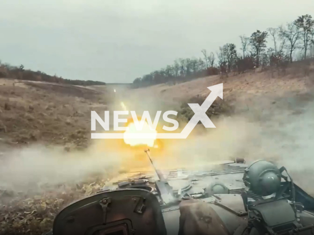 Captured Russian BMP-2 infantry fighting vehicle shoots against Russian occupiers in Ukraine. The footage was obtained from the the Kastuś Kalinoŭski Regiment on Wednesday, Dec. 7, 2022. Note: Picture is a screenshot from a video (@belwarriors/Newsflash)