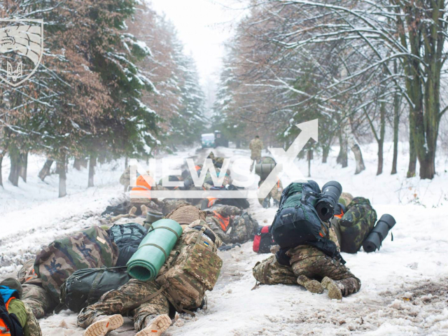 Ukrainian recruits lay on the snowy ground in snowy conditions in Ukraine in undated photo. It was during the selection stage for the qualification course to become soldiers of the Special forces of Ukraine. Note: Photo is obtained from the educational and training center of the Special forces of Ukraine. (@trainingcentreuasof/Newsflash).