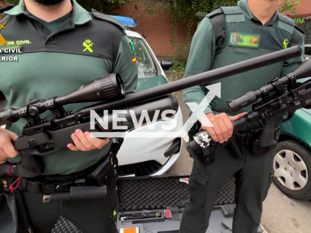 A police officers poses with the weapons seized, in Villamediana de Iregua, Spain, undated. Police arrested a 41-year-old man that was shooting from a window of his home, with compressed air weapons at homes and schools, there is no record that he fired at people, but his action had created alarm in the area due to the risk it entailed for the neighbourhood. Note: Police photo. (Newsflash)