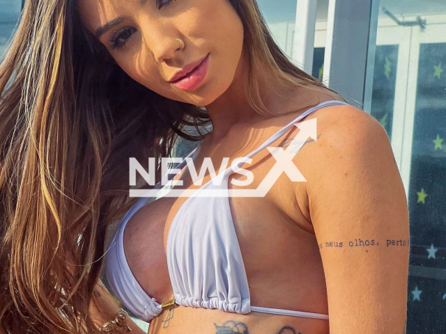 Brazilian influencer Maria Lina, poses in undated photo. She shared on hers social media the issues she had   with the surgery to place an implant in her breasts, in December, 2022. Note: Private photo.  (@marialdgg/Newsflash)