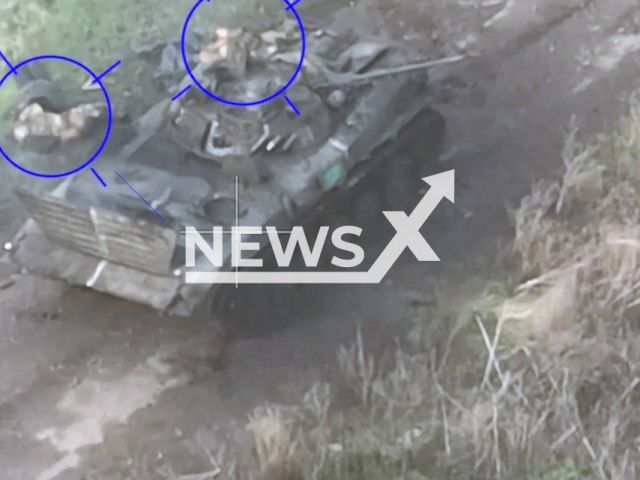 Picture shows wounded Ukrainian soldiers near their tank on the road near Soledar, Donetsk region, Ukraine. The footage was obtained from the People's Militia of the LPR on Thursday, Dec. 8, 2022. Note: Picture is a screenshot from a video (@millnr/Newsflash)