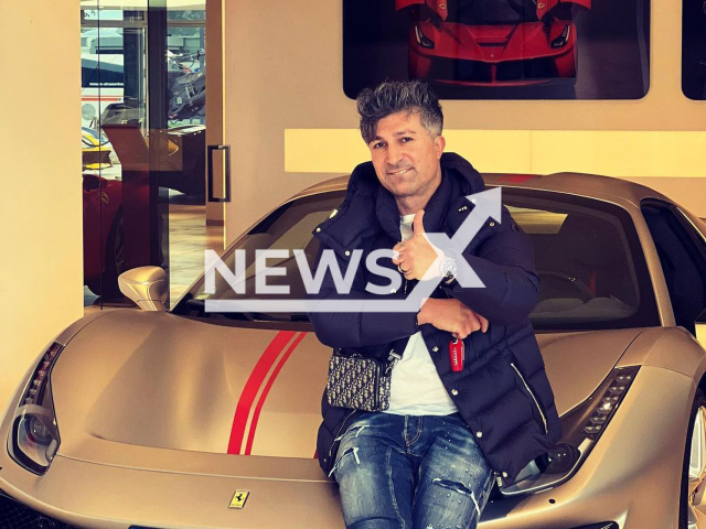 Kursat Yildirim, aged 42, from the city of Dortmund, in North Rhine-Westphalia, Germany, poses with his new Ferrari in undated photo. He reportedly dumped his 50-year-old ex girlfriend, after he won the EUR 9.9 million (GBP 8.7 million) lottery jackpot in September 2022. Note: Private photo. (@chicoferrari488/Newsflash)