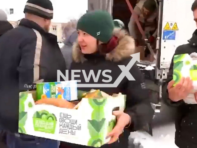 Russian military personnel delivered 20 tons of humanitarian aid to residents of the Ivankovsky district of the Kiev region, Ukraine. Note: This picture is a screenshot from the video. (Ministry of Defense of Russia/Newsflash)