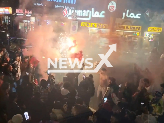 Morocco fans go wild after surprise win over Spain, in London's Edgware Road, England, on Tuesday, Dec. 6, 2022. The Spanish team didn't score a single penalty during the penalty shootout. Note: Picture is a screenshot from a video (@luciebickerdike/Newsflash)