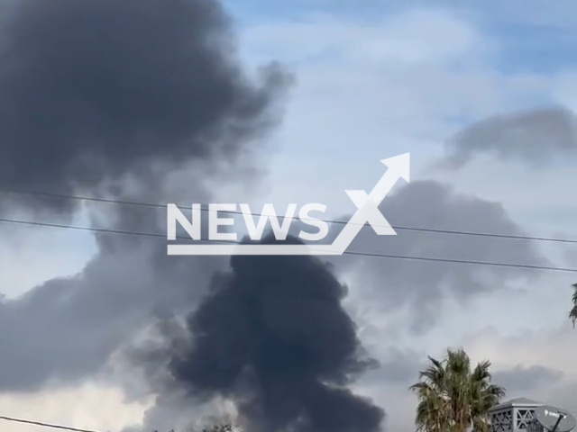 Black smoke emerges from a refinery in El Segundo, California, on Thursday, Dec. 6, 2022. The black smoke was a result of a flaring event and no one was injured. Note: Picture is a screenshot from a video (@TurfNSurf22/Newsflash)