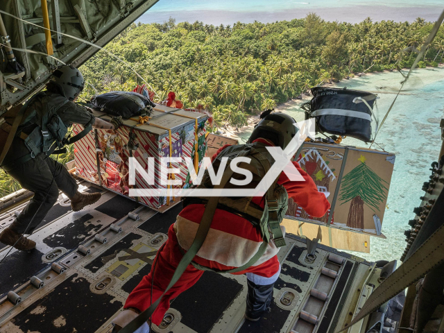 Image shows Senior Airman Janealle Hogans, and Master Sgt. Luke McLimans, in undated photo. They dropped four humanitarian aid bundles over Fananu atoll in the state of Chuuk, Federated States of Micronesia, on Friday, Dec. 9, 2022. Note: Licensed content. (U.S. Forces Japan/Clipzilla)