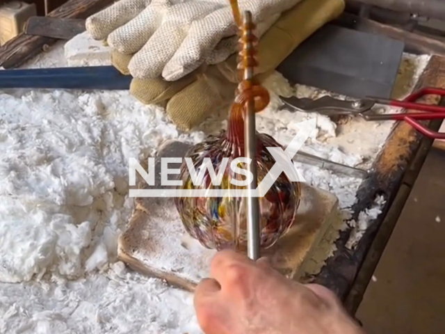 Members of Decatur Glassblowing showcase the process of glassblowing, in October 2022, in Decatur, Atlanta. Completion of the piece took about an hour in the hot process excluding the cool-down time and finishing touches. Note: Picture is a screenshot from a video (@decaturglassblowing/Newsflash)