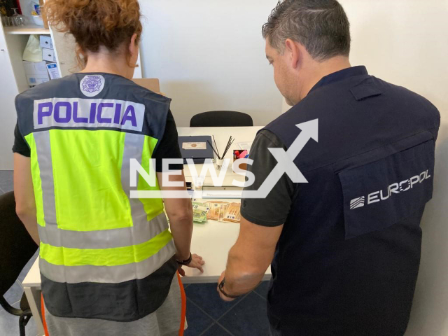 Picture shows police officers with the money sized in Tenerife, Spain, undated. The police operation  uncovered  corruption in Russia that led to the theft of some USD 230 million committed by senior public officials used to buy property in Spain. Note: Police photo. (Newsflash)