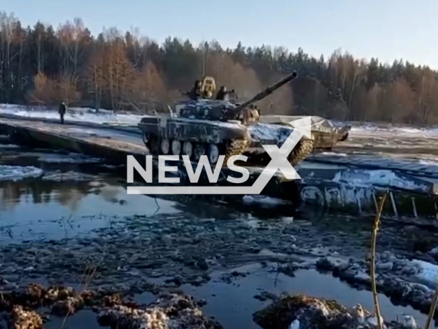 During the check of combat readiness Belarusian tank crosses the Neman River on a pontoon-bridge crossing in Belarus in undated footage.
The footage was released by the Belarusian MoD on Wednesday, Dec. 14, 2022.
Note: This picture is a screenshot from the video.
(@modmilby/Newsflash)

Note: Picture is screenshot from a video (@modmilby/Newsflash).