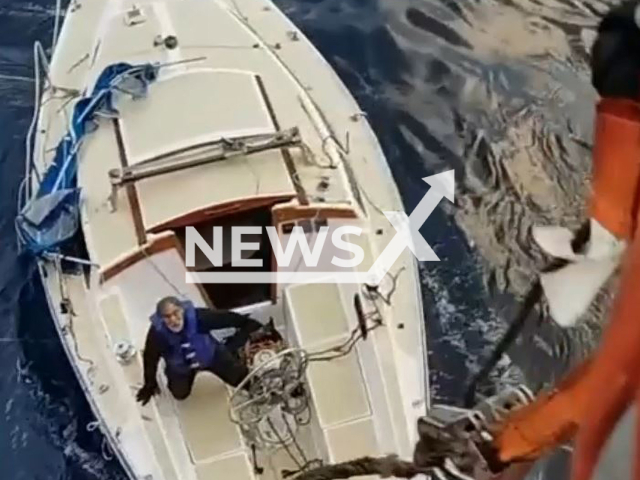 Rescuers rescue two men and their dog after being lost at sea for 10 days when their sailboat went adrift in the middle of the Atlantic Ocean on Tuesday, Dec. 13, 2022. The three were later transferred to Coast Guard Station New York. Note: Picture is screenshot from a video (DVIDS, Logan Kaczmarek/Newsflash).