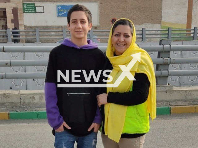 Amirhossein Rahimi poses with his mother in an undated photo. He was released from detention after getting arrested in Karaj, Iran, in Oct. 2022. Note: Picture is private (Newsflash)