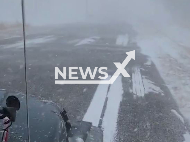 Picture shows a blizzard in Brush, Colorado, on Tuesday, Dec. 13, 2022. According to BigDawgAndSonsWx, the wind was howling and the snow was drifting high. Note: Picture is screenshot from a video. (@DawgWx/Newsflash)