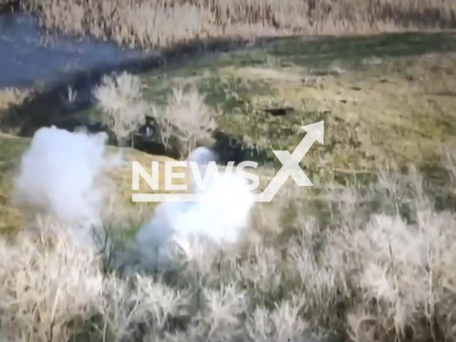 Picture shows an explosion near trees in a field area of Ukraine. The footage was obtained from the Donetsk separate brigade of the Territorial Defense Forces on Friday, Dec. 16, 2022. Note: Picture is a screenshot from a video (@donobrtro/Newsflash)