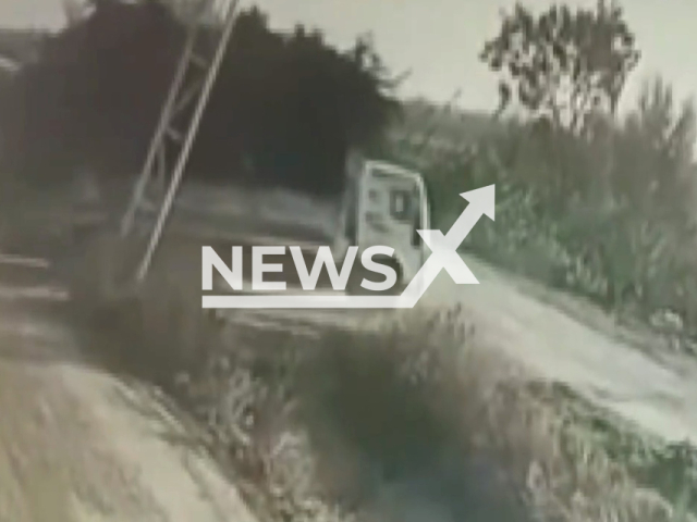 A truck loaded with wood, carries away a sign in Tarsus, Mersin, undated video. The truck which carried the sign on the neighbouring road unintentionally changed a village entrance. Note: Picture is a screenshot from a video (Newsflash)