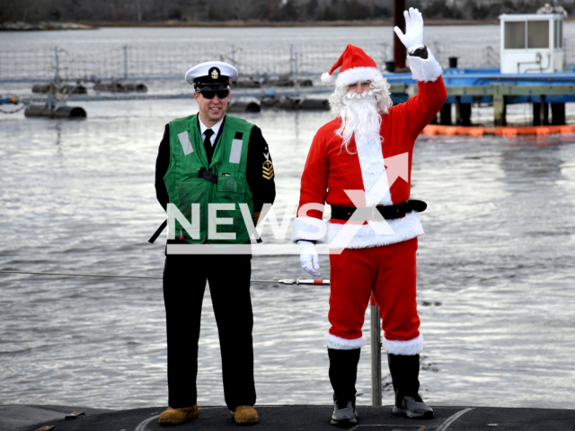 Santa Claus waves onboard the USS South Dakota (SSN 790) during a homecoming event at Naval Submarine Base New London in Groton, Conn., Dec. 18. South Dakota returned to homeport after a five-month deployment in support of the chief of naval operations’ maritime strategy. Note: Navy picture. (U.S. Navy , Chief Petty Officer Joshua Karsten/Newsflash)