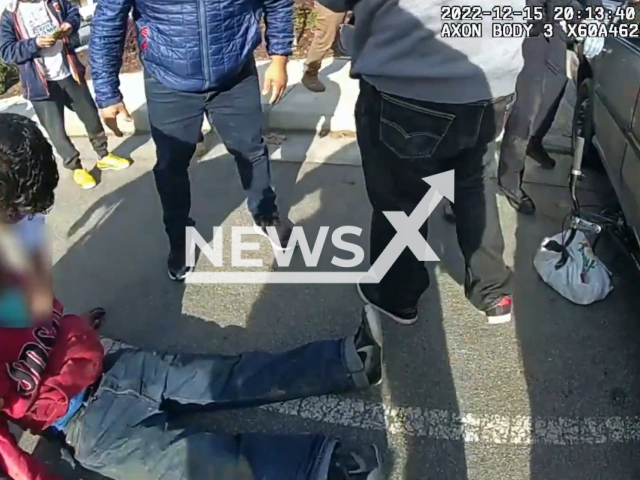 California officers and civilians rescue a  65 years old cyclist trapped underneath a car in Watsonville, California, USA, undated. The cyclist was not named. Note: This picture is a screenshot from the video. (Watsonville Police Department/Newsflash)