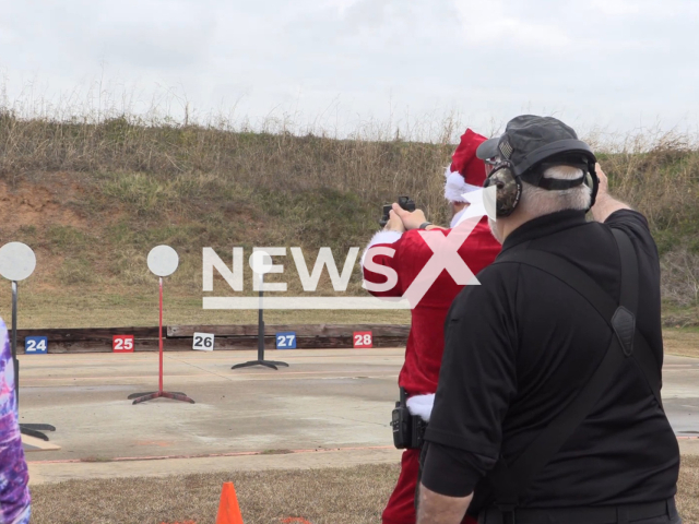 Santa participates in the Christmas-themed game event organized by the local Sheriff's Office to raise donation money for a new homeless center in Caddo Parish, Louisiana, the USA, undated. Note: This picture is a screenshot from the video. (Caddo Parish Sheriff/Newsflash)