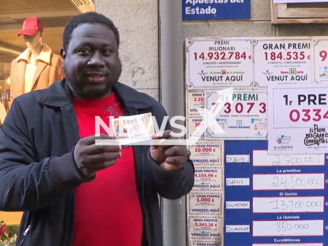 Gambian  migrant Ibrahim  Kante poses in undated photo. He  won the Christmas Lottery's   second prize, the first time he ever played the lottery, in Olot, Spain, in December, 2022.
Note: Photo is a screenshot from a video. (Newsflash)