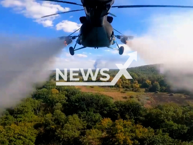 Ukraine's military helicopters launch a barrage of missiles towards Russian forces in Ukraine in undated footage.
The footage was released by the Ground forces of the Armed Forces of Ukraine on Friday, Dec. 23, 2022. Note: This picture is a screenshot from the video. (@UkrainianLandForces/Newsflash)